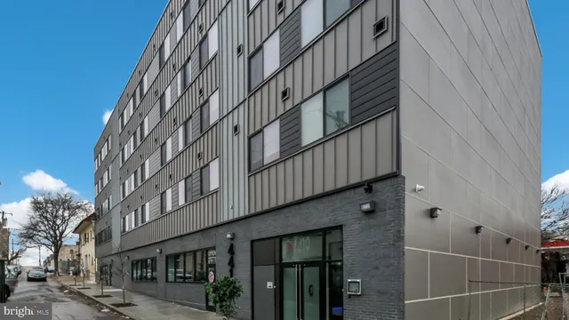 a kitchen with stainless steel appliances a refrigerator and a stove top oven
