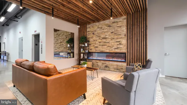 a kitchen with stainless steel appliances granite countertop a refrigerator and a microwave