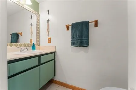 a bedroom with a bed and flat screen tv