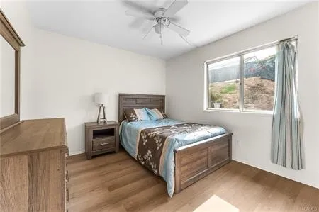 an empty room with closet and windows