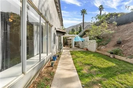 a view of house with backyard and garden