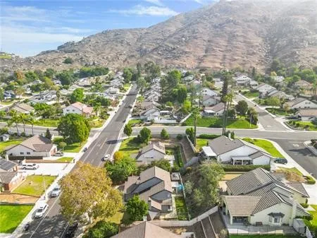 an aerial view of residential houses with city view