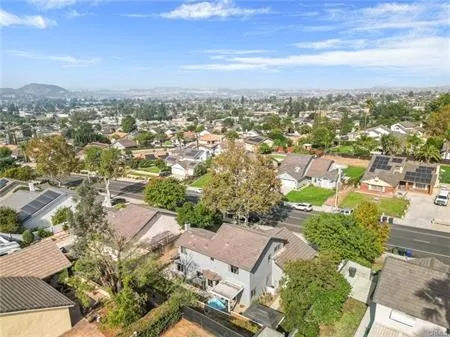 an aerial view of house with yard