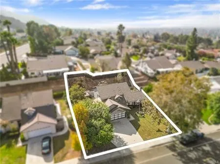 an aerial view of a house with outdoor space