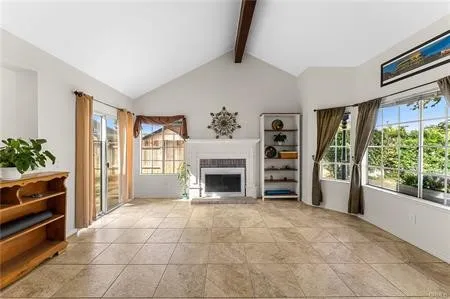 a view of a livingroom with wooden floor and a window