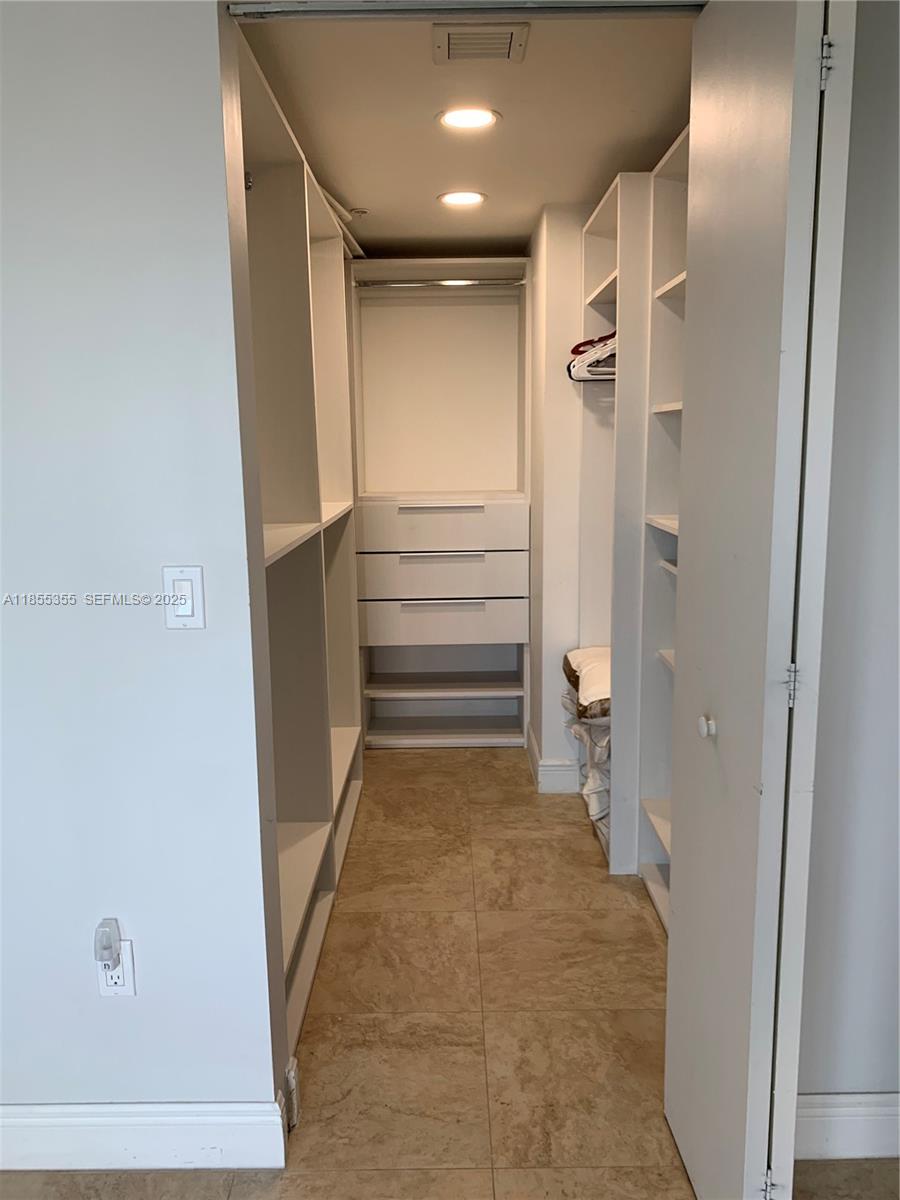 185 Southwest 7th Street, Unit 2202 Miami, FL 33130 - Photo 12 of 36 a view of room with a hallway