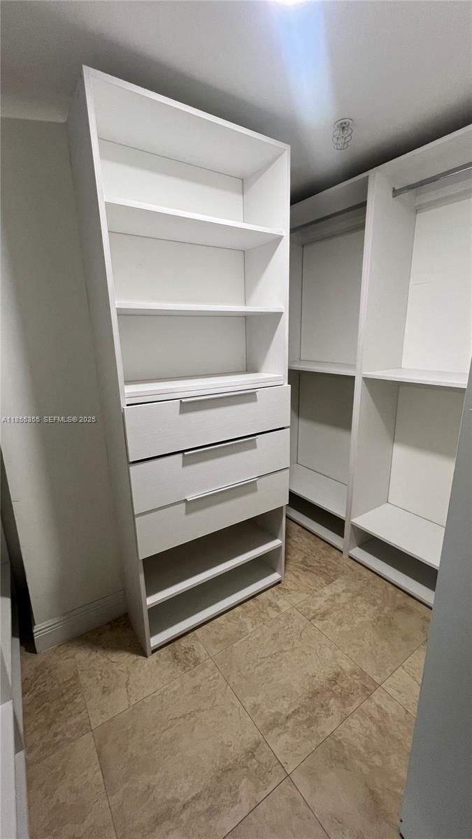 185 Southwest 7th Street, Unit 2202 Miami, FL 33130 - Photo 17 of 36 a view of an empty walk in closet
