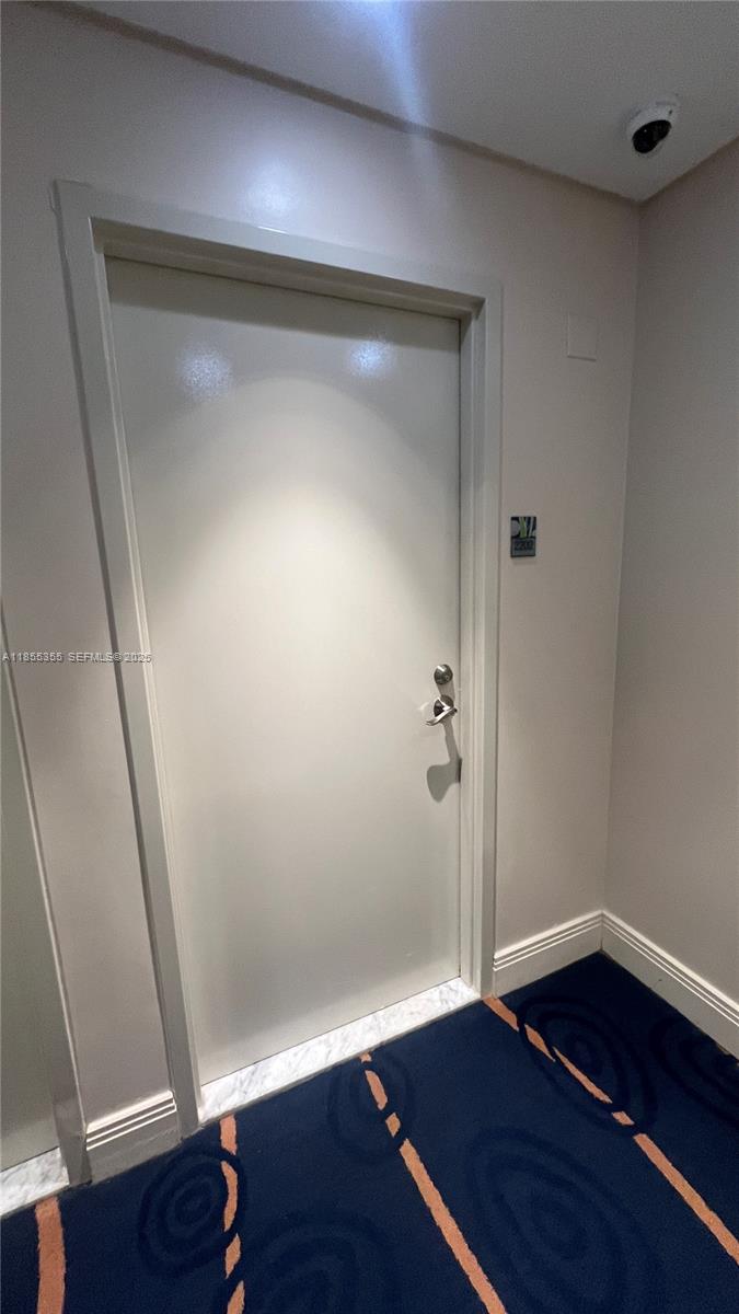 185 Southwest 7th Street, Unit 2202 Miami, FL 33130 - Photo 27 of 36 a view of empty room with wooden floor