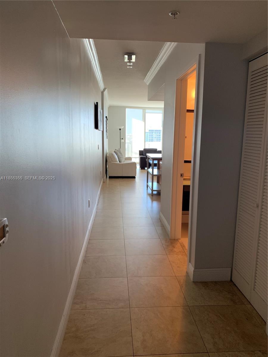 185 Southwest 7th Street, Unit 2202 Miami, FL 33130 - Photo 6 of 36 a view of hallway with livingroom and furniture