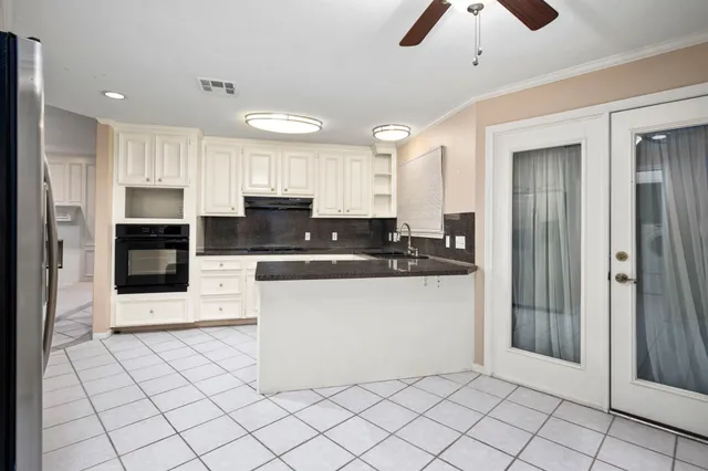 a large kitchen with cabinets