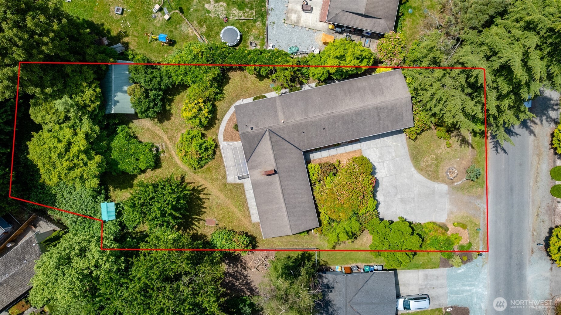 21316 Rolling Ridge Drive Sedro-Woolley, WA 98284 - Photo 36 of 37 an aerial view of a house with swimming pool and large trees