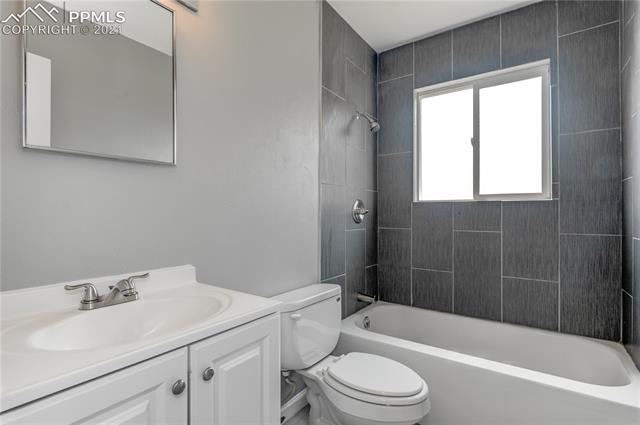 1744 Whitehall Road Colorado Springs, CO 80906 - Photo 14 of 25 Upstairs Bath. Full bathrooom remodel, new vanity, paint, toilet, tile.