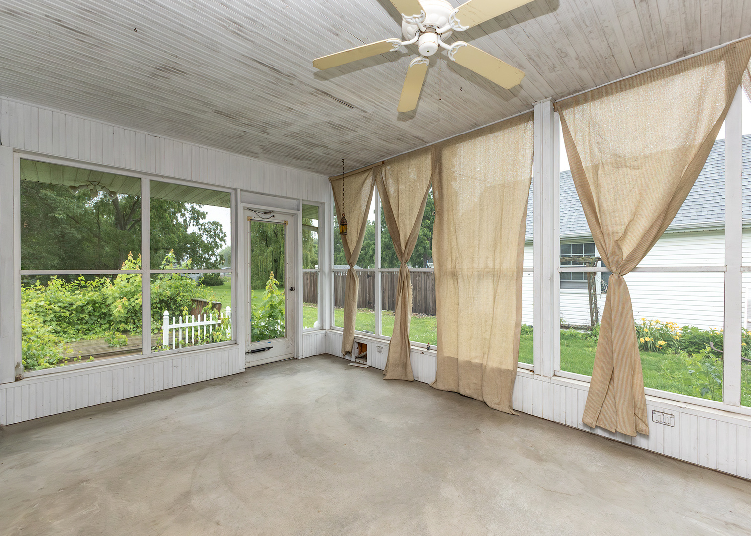1608 3rd Street Camanche, IA 52730 - Photo 7 of 25 a view of an empty room with windows
