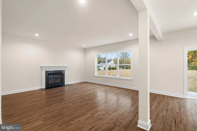 a view of kitchen with wooden floor and window
