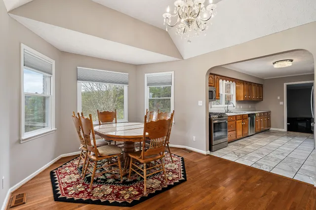 a view of a dining room with furniture window and wooden floor