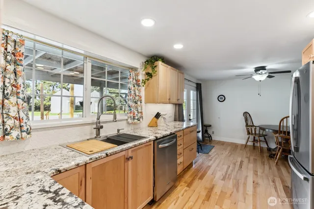 a kitchen with a sink and wooden cabinets