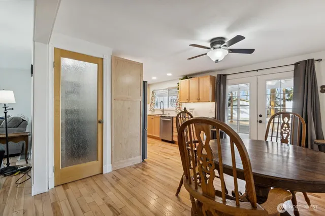 a view of a dining room with furniture window and wooden floor