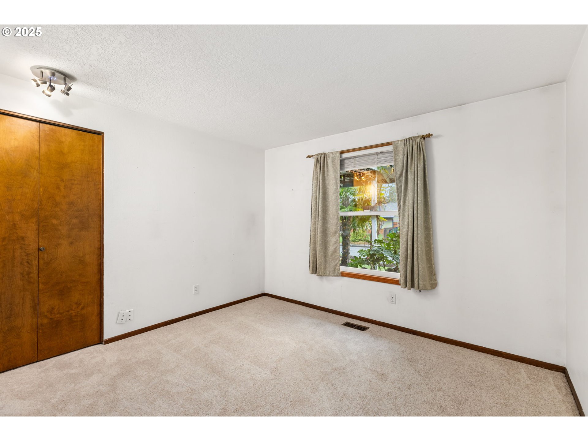 17130 Southwest Baker Street Beaverton, OR 97007 - Photo 22 of 37 a view of an empty room with a window