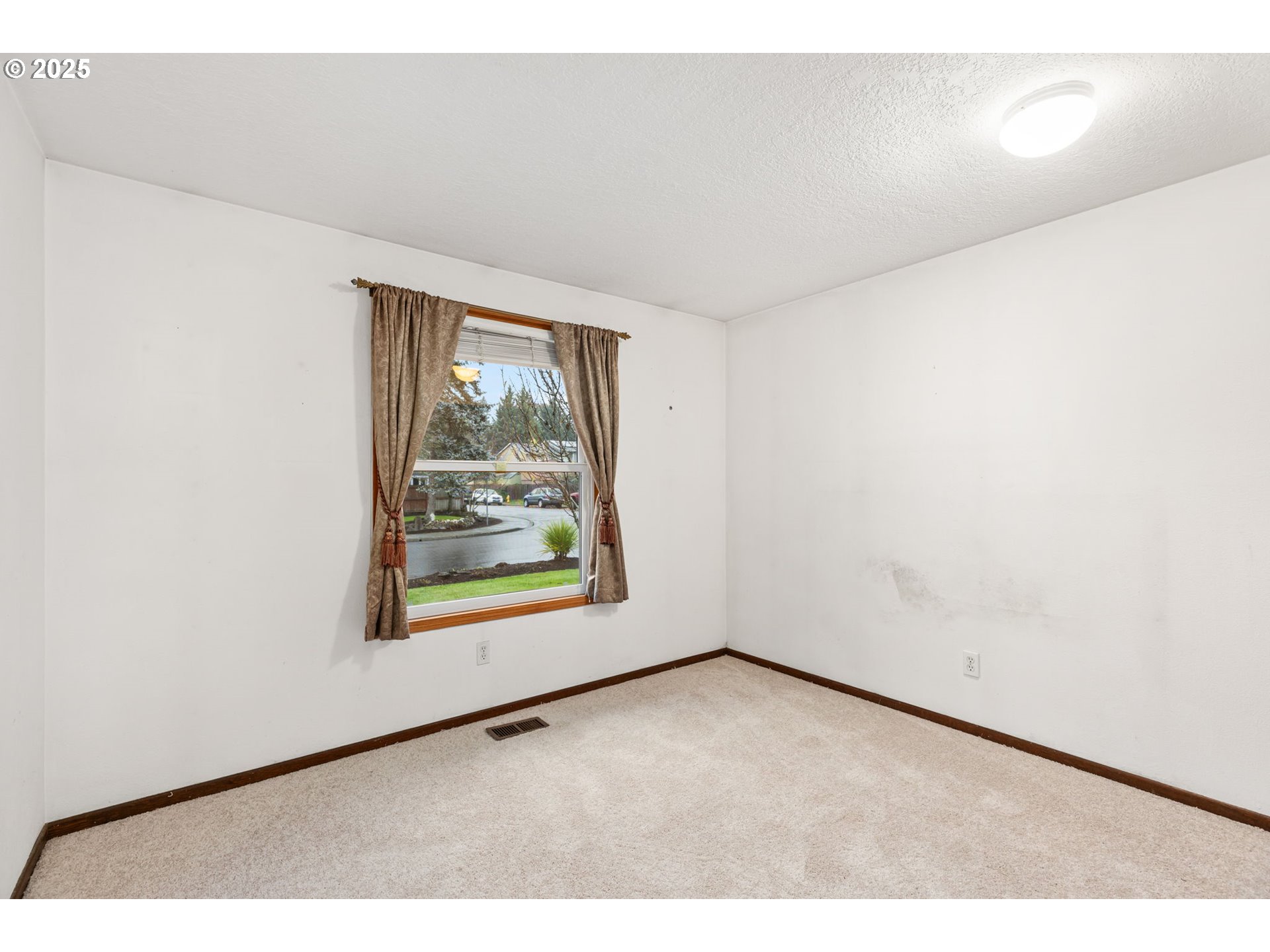 17130 Southwest Baker Street Beaverton, OR 97007 - Photo 23 of 37 a view of an empty room with a window