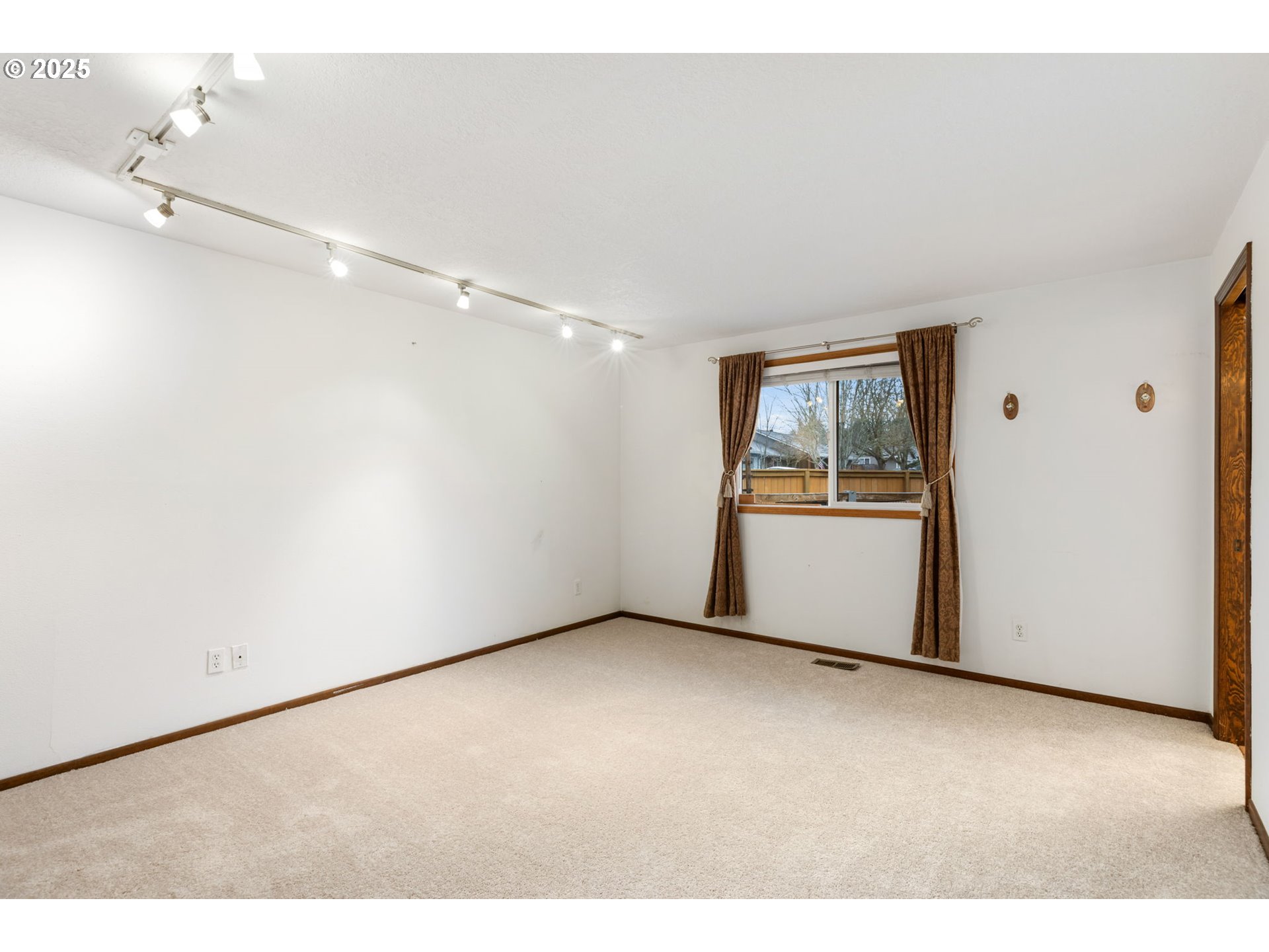 17130 Southwest Baker Street Beaverton, OR 97007 - Photo 24 of 37 a view of an empty room with a window