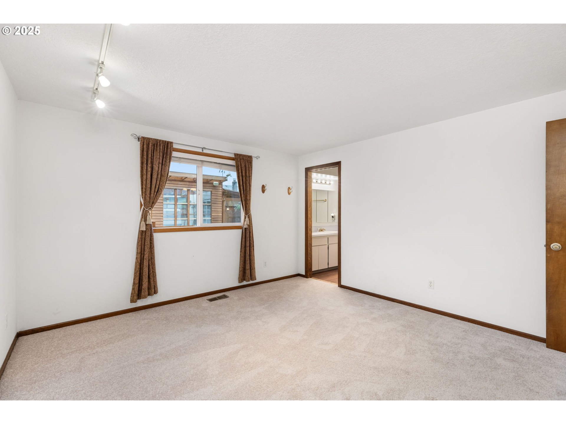 17130 Southwest Baker Street Beaverton, OR 97007 - Photo 25 of 37 a view of an empty room with a window