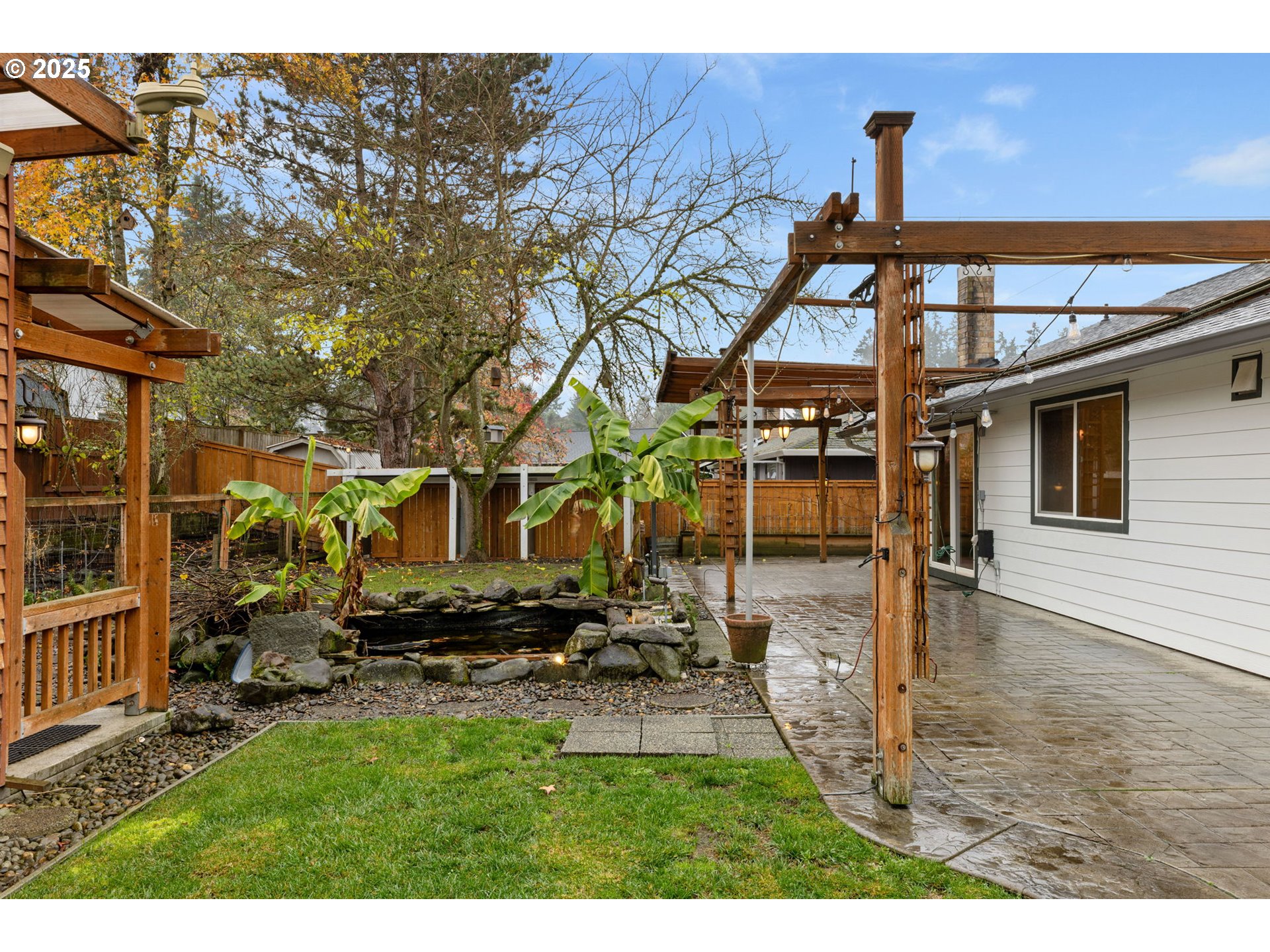 17130 Southwest Baker Street Beaverton, OR 97007 - Photo 32 of 37 a backyard of a house with table and chairs