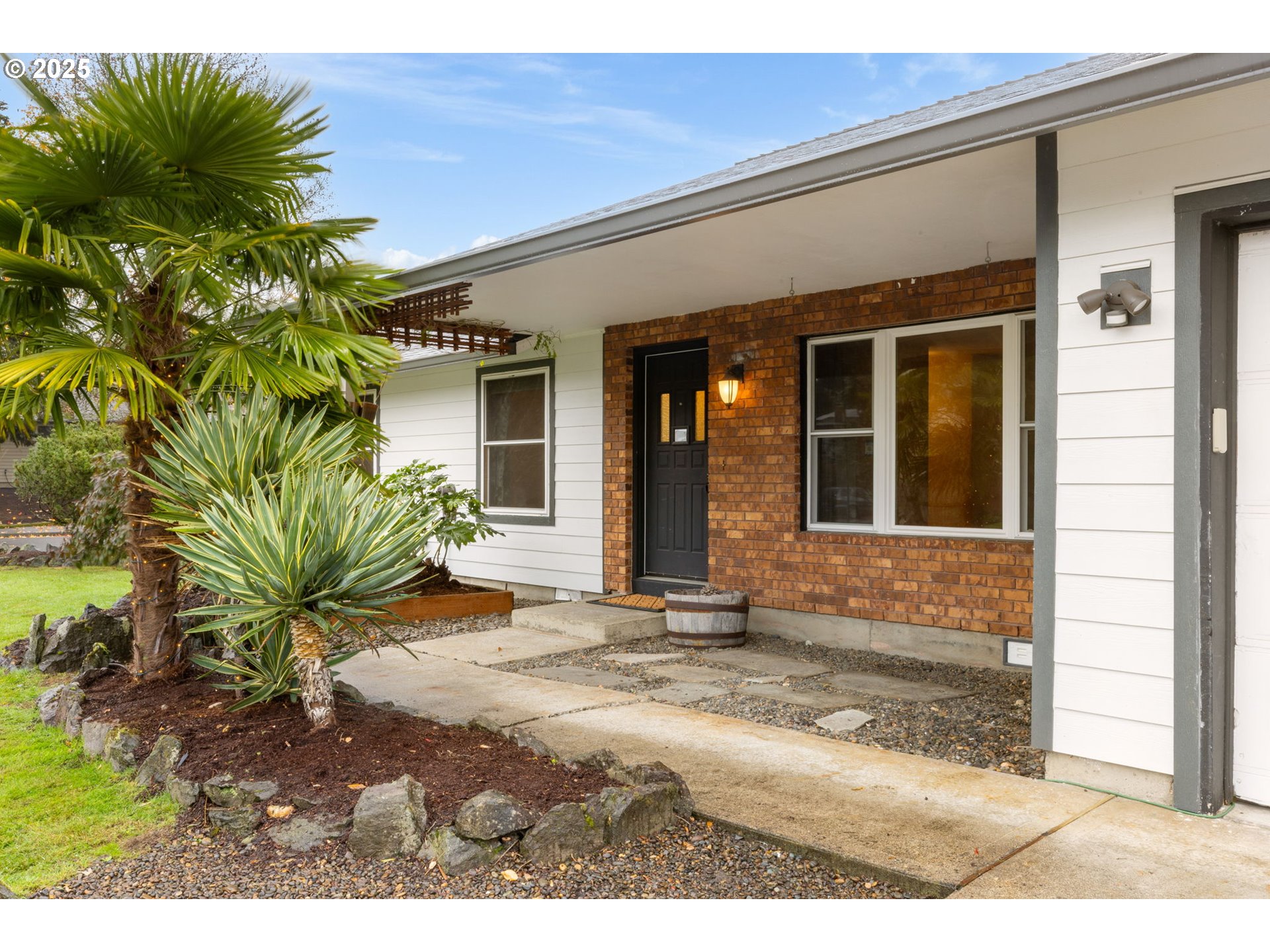 17130 Southwest Baker Street Beaverton, OR 97007 - Photo 5 of 37 a view of a house with a patio