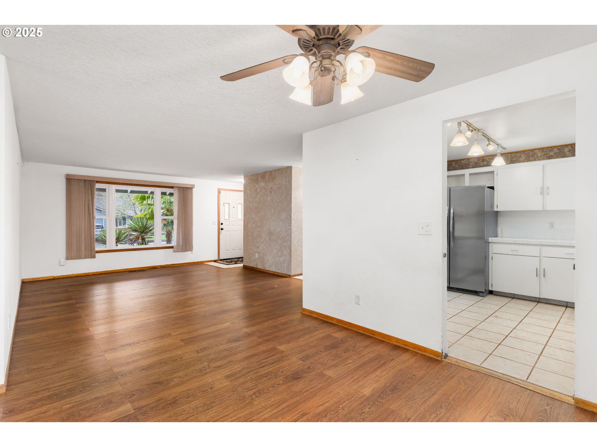 17130 Southwest Baker Street Beaverton, OR 97007 - Photo 9 of 37 a view of an empty room with a window