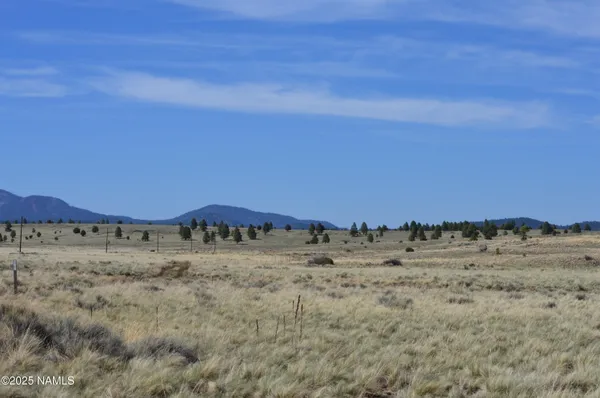 a view of mountain and an ocean