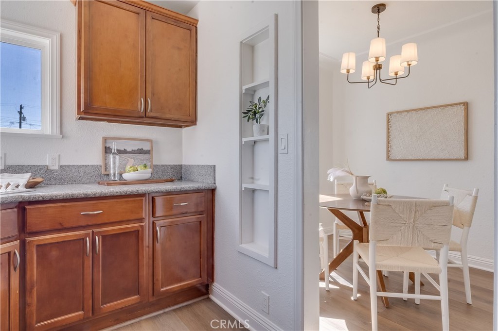 1347 East Bennett Street Compton, CA 90221 - Photo 12 of 31 a kitchen with stainless steel appliances granite countertop a sink and cabinets