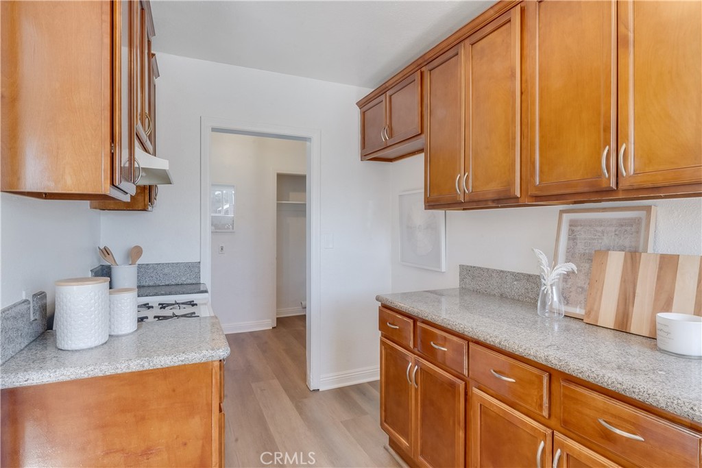 1347 East Bennett Street Compton, CA 90221 - Photo 14 of 31 a kitchen with a sink and cabinets