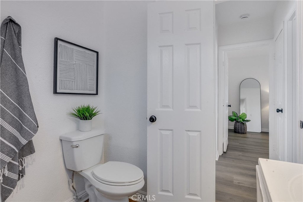 1347 East Bennett Street Compton, CA 90221 - Photo 18 of 31 a white toilet sitting next to a bathroom