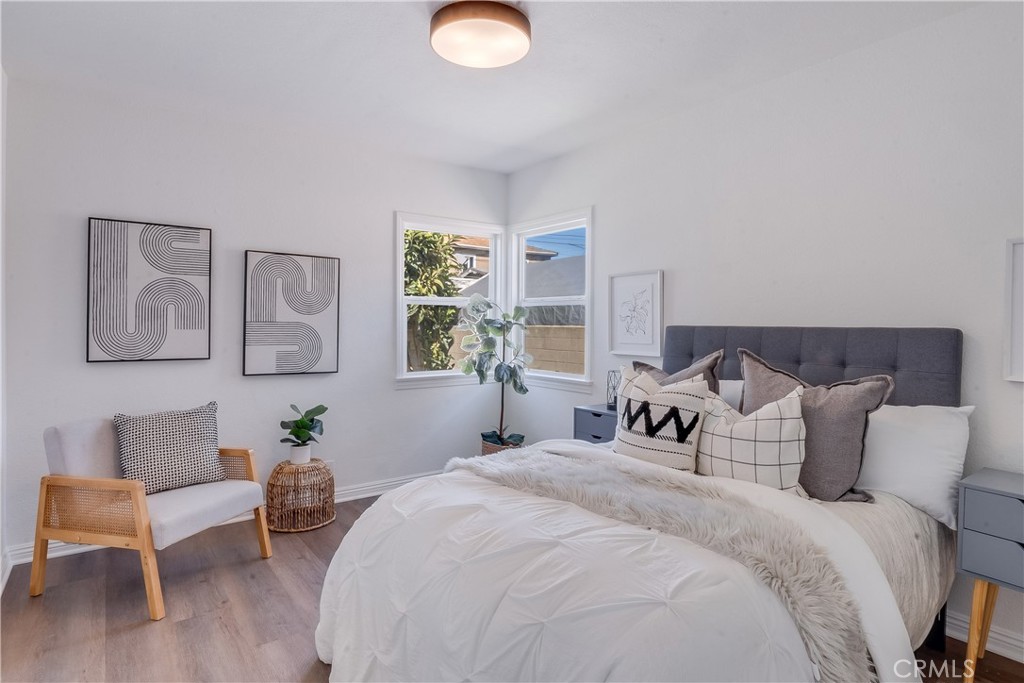 1347 East Bennett Street Compton, CA 90221 - Photo 19 of 31 a bedroom with bed and a window