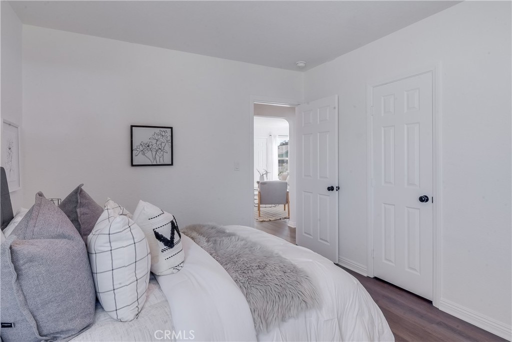1347 East Bennett Street Compton, CA 90221 - Photo 20 of 31 a bedroom with a bed and a painting on the wall