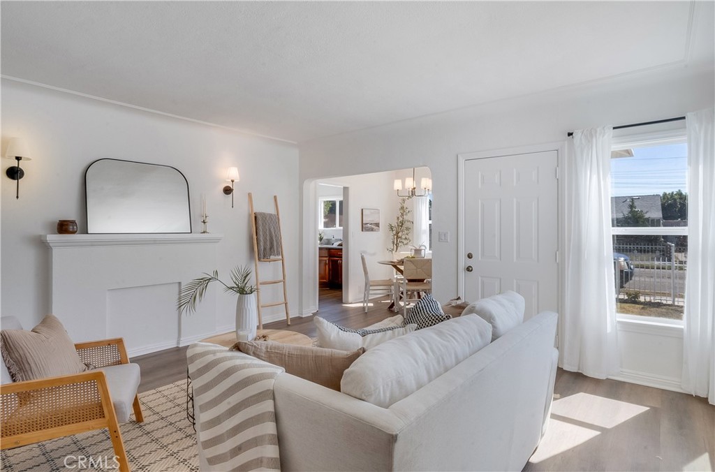 1347 East Bennett Street Compton, CA 90221 - Photo 2 of 31 a living room with furniture and a wooden floor