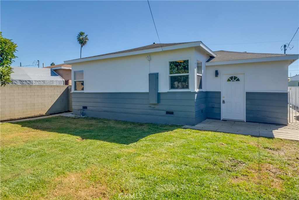 1347 East Bennett Street Compton, CA 90221 - Photo 22 of 31 a view of a house with a backyard