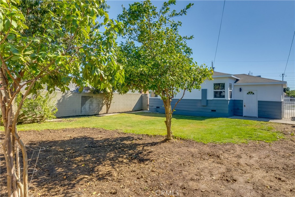 1347 East Bennett Street Compton, CA 90221 - Photo 24 of 31 a house with a tree in front of it