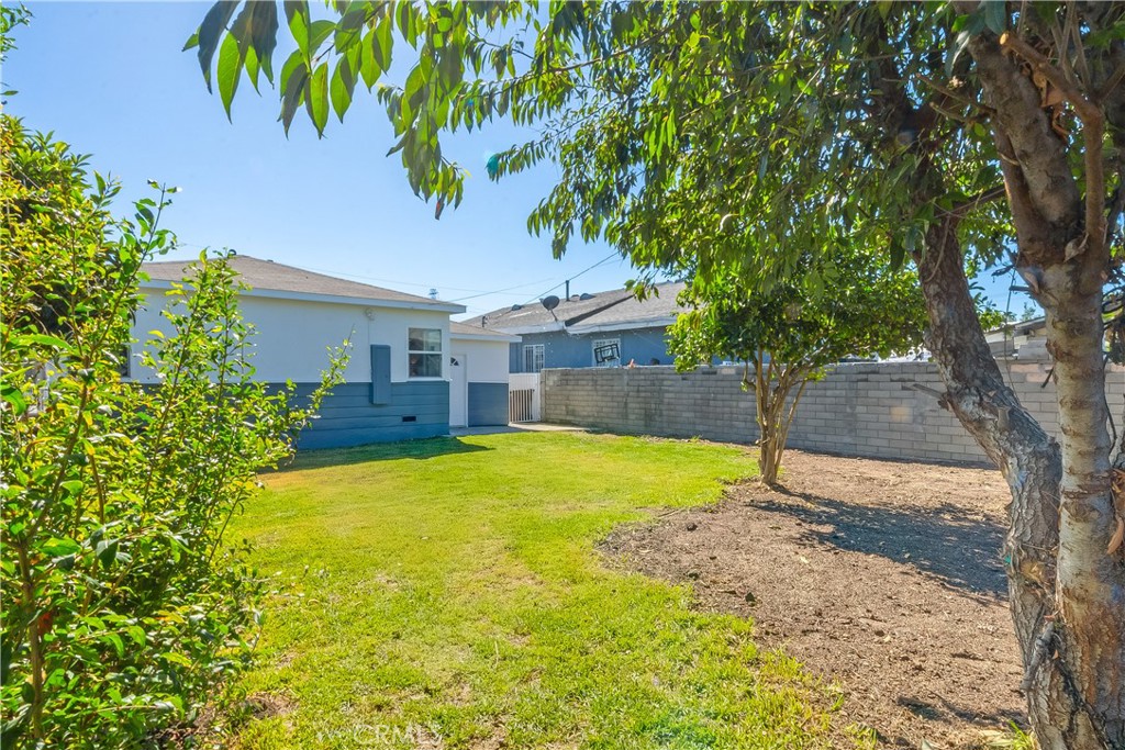 1347 East Bennett Street Compton, CA 90221 - Photo 25 of 31 a front view of a house with a yard
