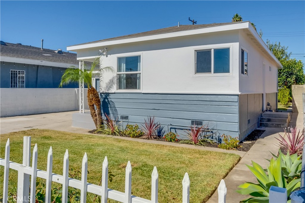 1347 East Bennett Street Compton, CA 90221 - Photo 28 of 31 a front view of a house with a yard