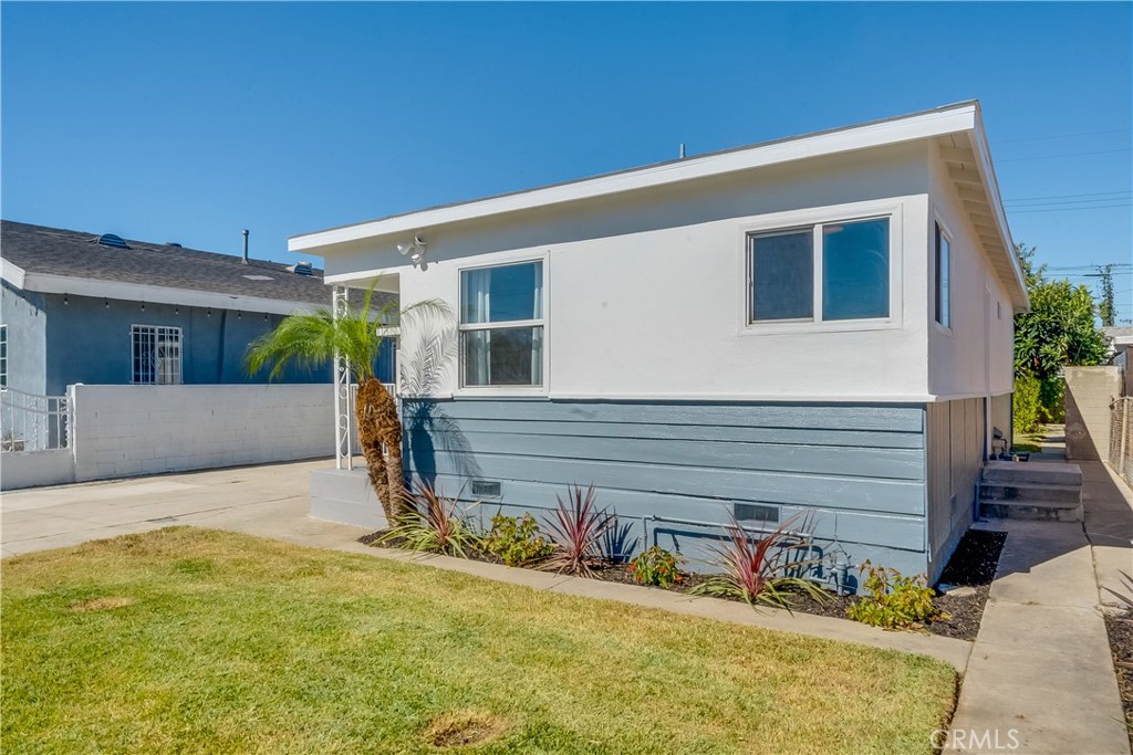 1347 East Bennett Street Compton, CA 90221 - Photo 29 of 31 a view of a house with backyard and sitting area
