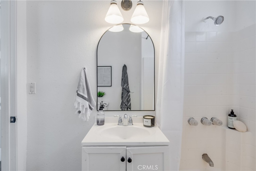 1347 East Bennett Street Compton, CA 90221 - Photo 5 of 31 a bathroom with a sink and a mirror