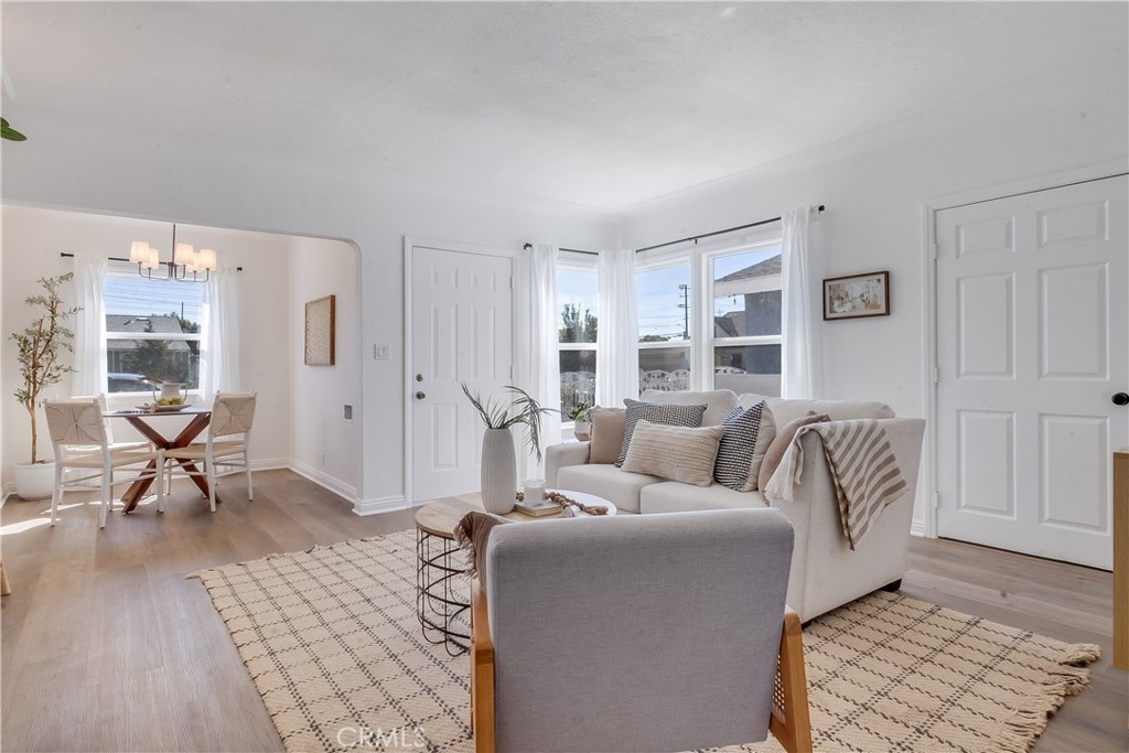 1347 East Bennett Street Compton, CA 90221 - Photo 7 of 31 a living room with furniture and a rug