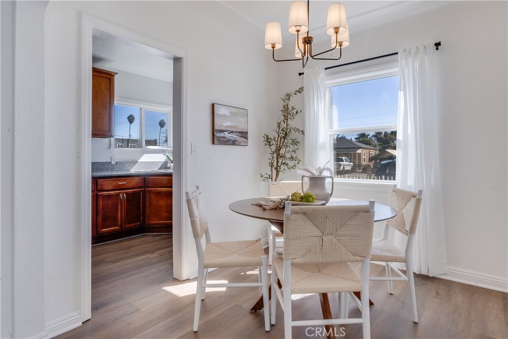1347 East Bennett Street Compton, CA 90221 - Photo 9 of 31 a view of a dining room with furniture and wooden floor