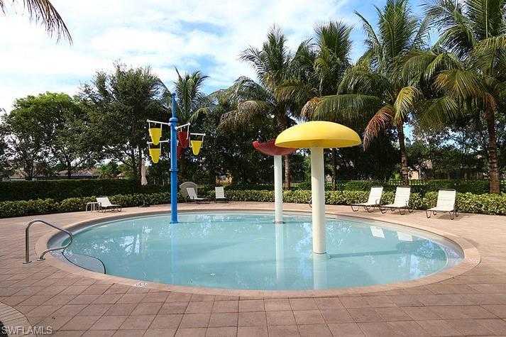 6525 Monterey Point, Unit 203 Naples, FL 34105 - Photo 23 of 25 a view of a swimming pool with an outdoor seating