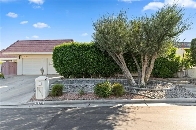 a swimming pool with outdoor seating