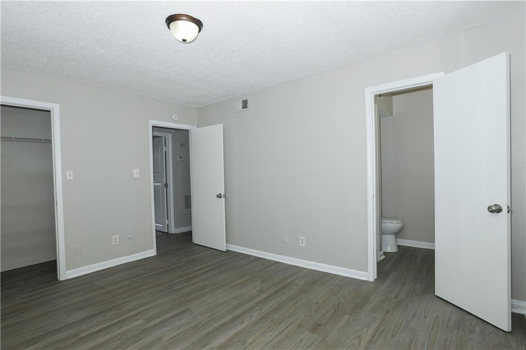 2065 Alison Court Southwest, Unit 6 Atlanta, GA 30311 - Photo 7 of 14 a view of a room with wooden floor and a toilet