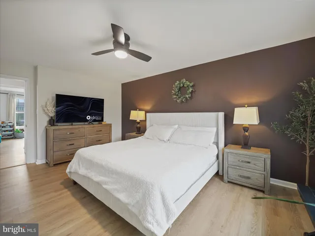 a large white bed in a white room