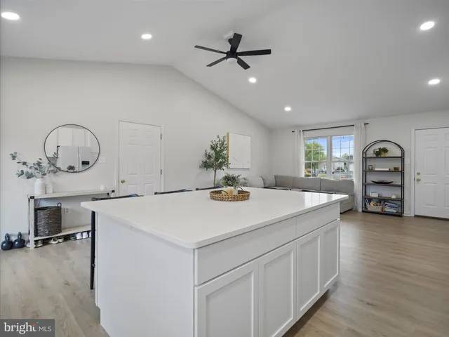 a kitchen with a stove a sink and a refrigerator