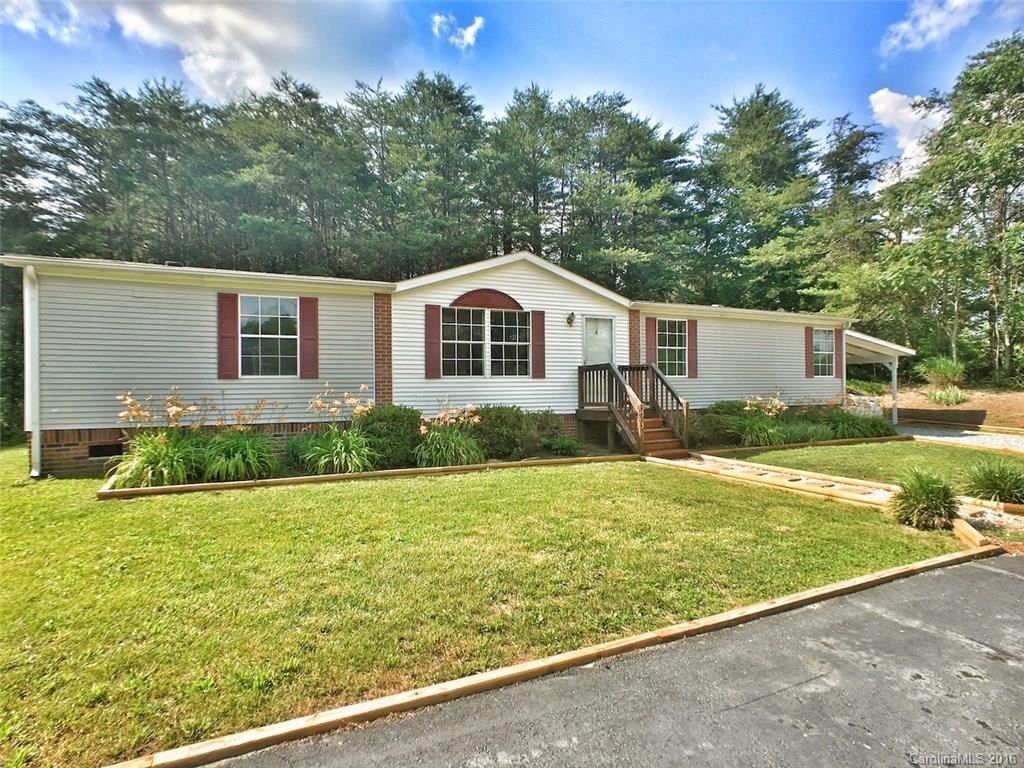 5563 South Wilson Hill Road Mill Spring, NC 28756 - Photo 1 of 18 a view of a house with a yard