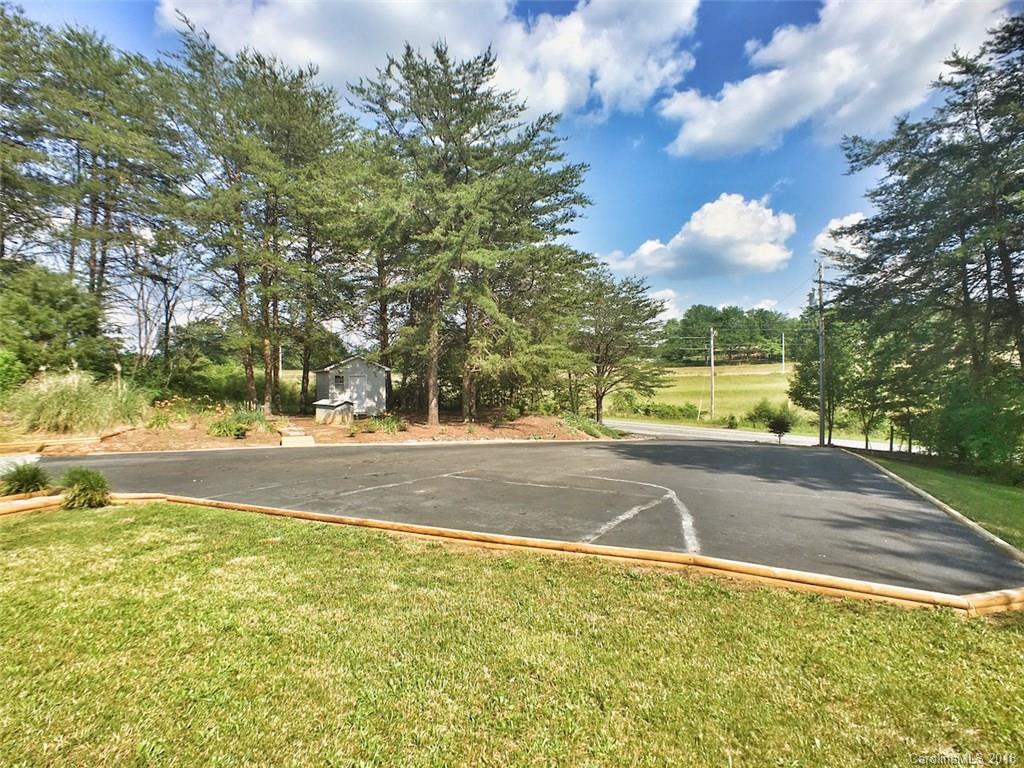 5563 South Wilson Hill Road Mill Spring, NC 28756 - Photo 4 of 18 a view of yard with swimming pool and green space